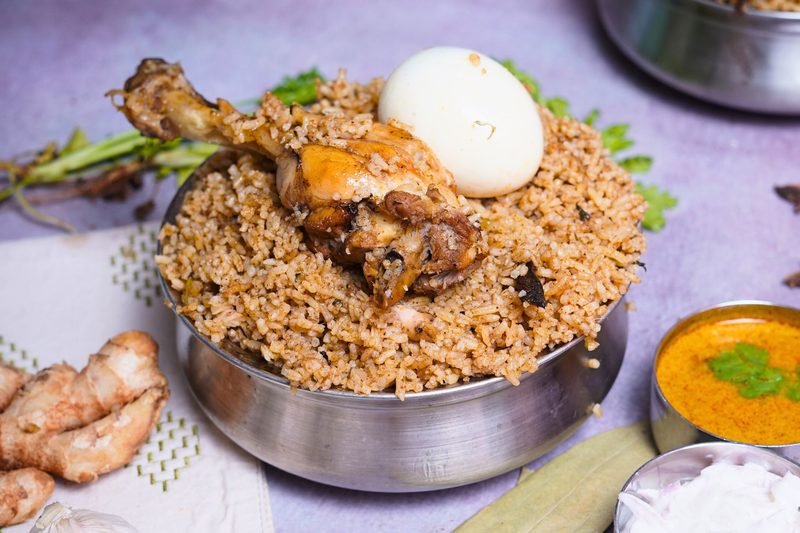 Sivakannan signature mutton biryani served in traditional brassware